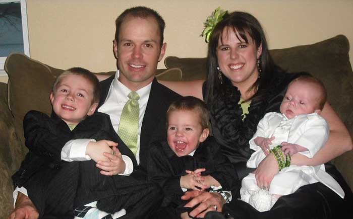 Heather Osmond taking picture with her family.